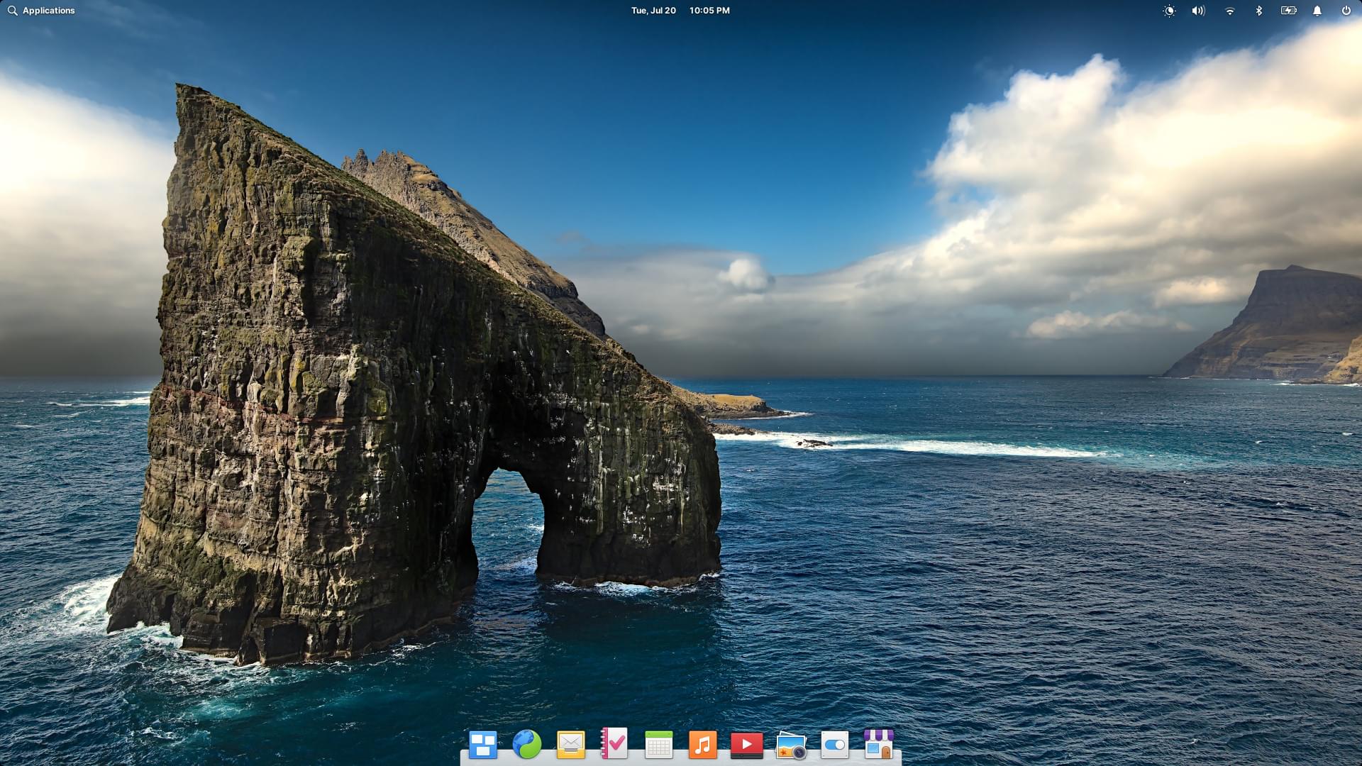 Elementary OS desktop UI; dock at the bottom, and the top bar